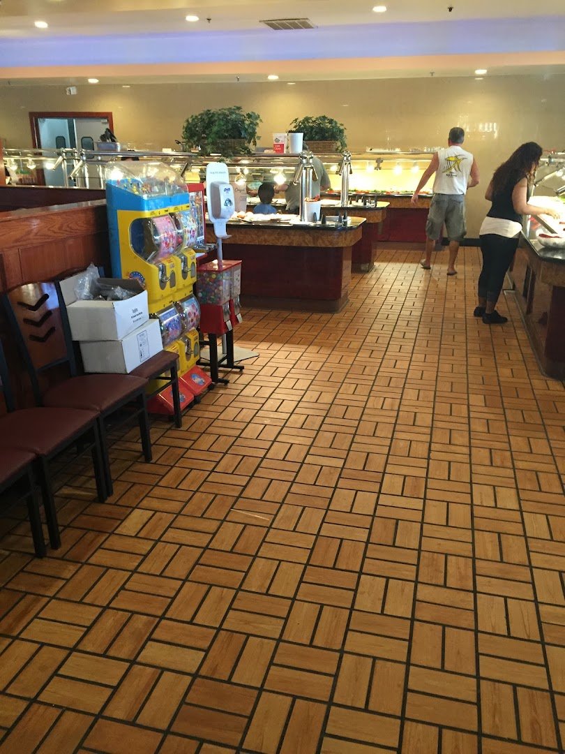 Buffet trays lined with Chinese dishes.